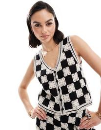 Προσφορά Mango crochet square co-ord waistcoat in white and black για 66,99€ σε Asos